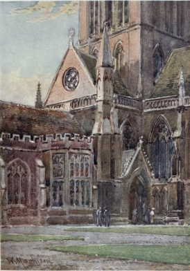 ENTRANCE TO ST. JOHN’S COLLEGE CHAPEL FROM THE FIRST
COURT

In the corner on the right is seen the Doorway of the Chapel, with the
tower rising above it. On the left is part of the Hall with a fine oriel
window.